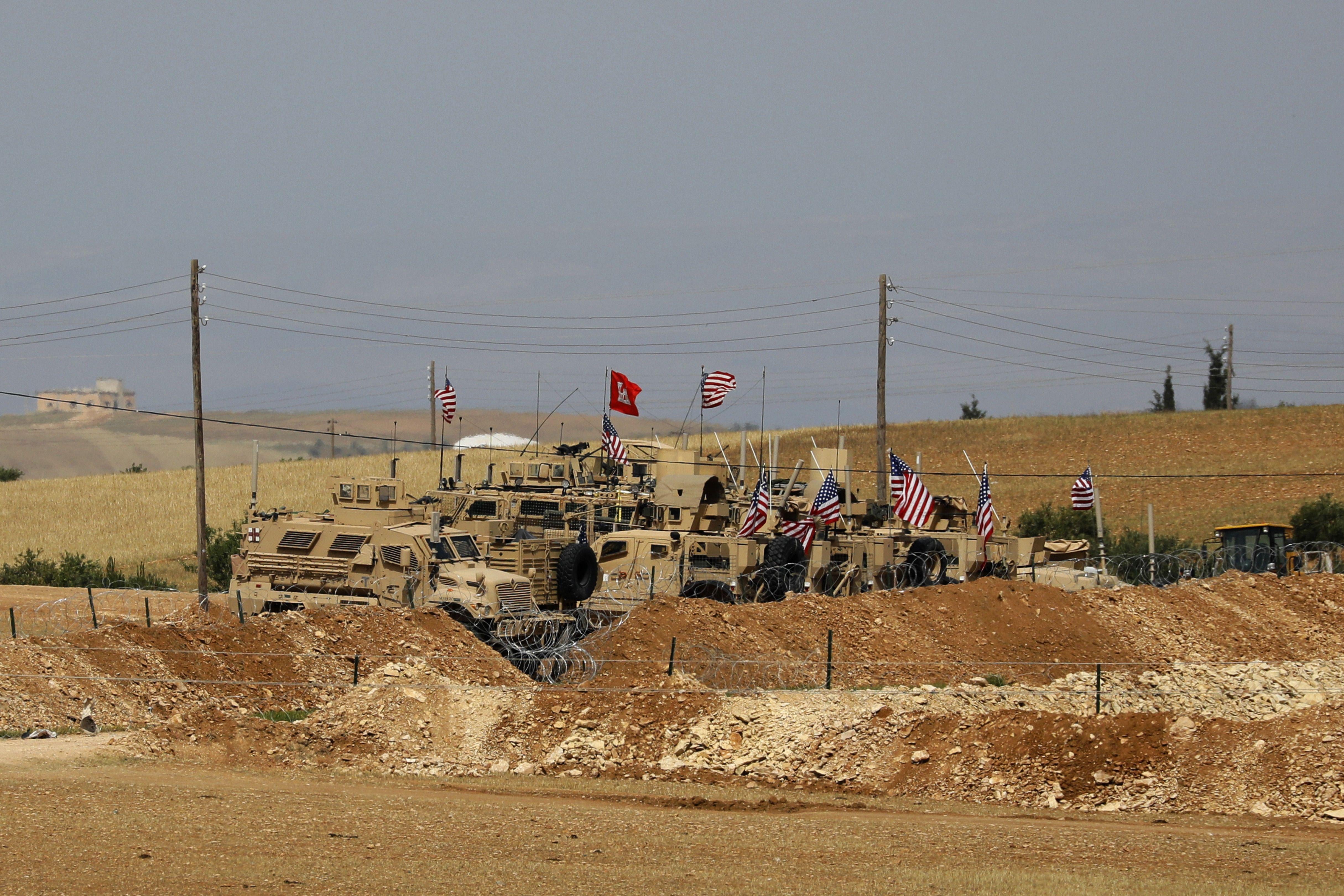 Vehicles of the U.S.-backed coalition forces in the northern Syrian town of Manbij