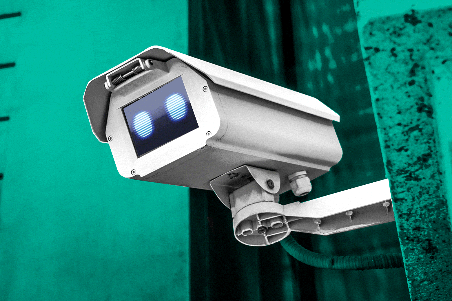 A surveillance camera with a robotic eye looking out of it.