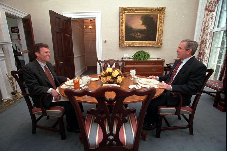 Tom Daschle and George W. Bush sit in the Presidential Dining Room.