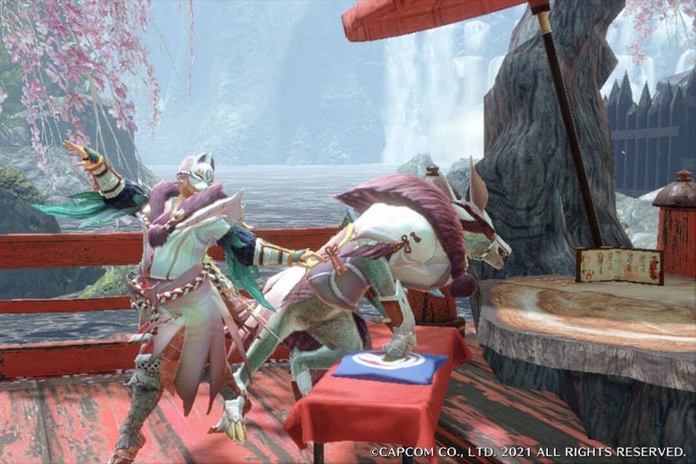 A character in a pink and white costume and cat-like helmet stand on a red bridge next to a dog-like creature, who is leaping upon to a tree stump. Behind them is a large body of water, as well as a large tree and a fence made of wooden stakes. There are some cherry blossoms blooming from the tree branches. 