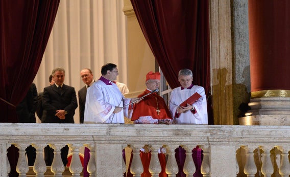 French proto-deacon cardinal Jean-Louis Tauran (center) announces the name of the new pope, Argentinian cardinal Jorge Mario Bergoglio on March 13, 2013, from the balcony of St Peter's basilica at the Vatican.