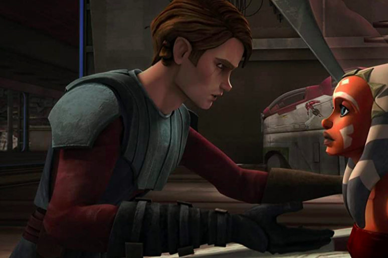 In a 3D animated style, a human man crouches and puts a hand on the shoulder of a young Ahsoka Tano.