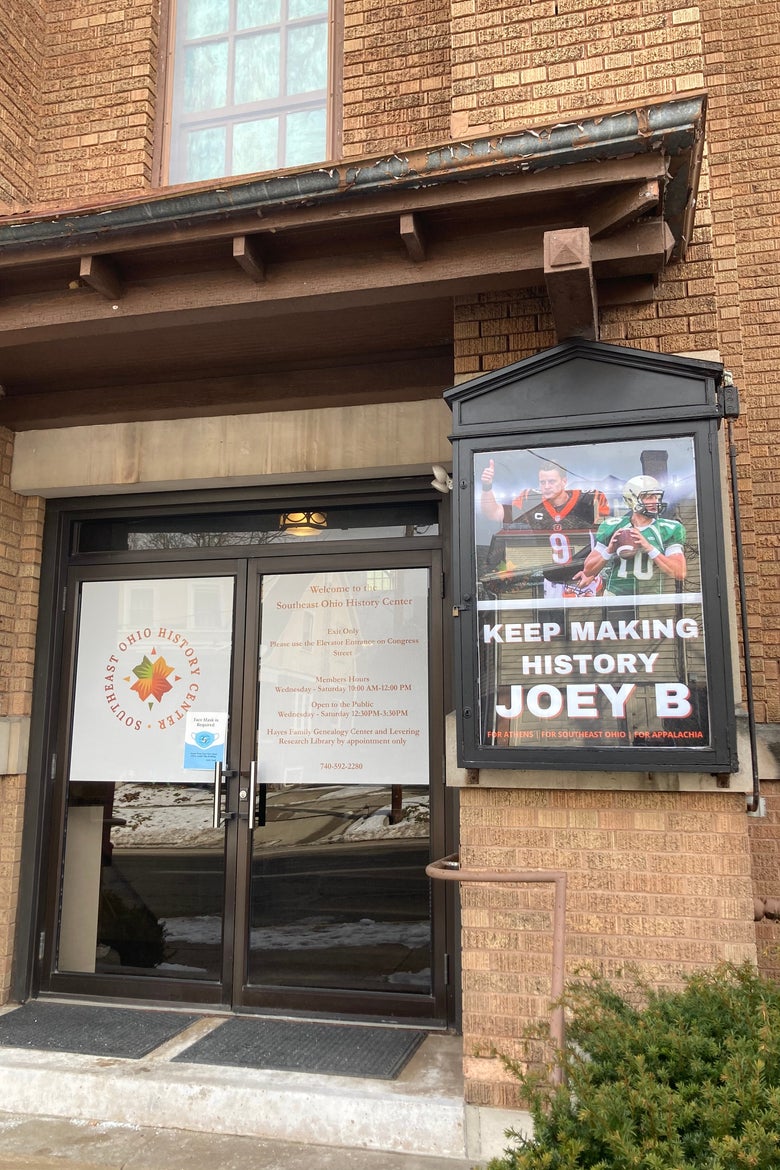 A poster says "Keep writing the Joey B story."