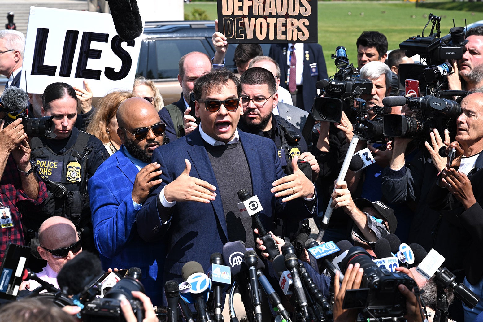 Rep. George Santos at his indictment last week, in his signature uniform.