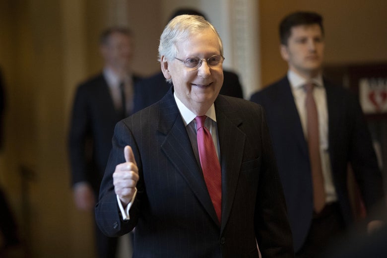 Mitch McConnell gives a thumbs-up.