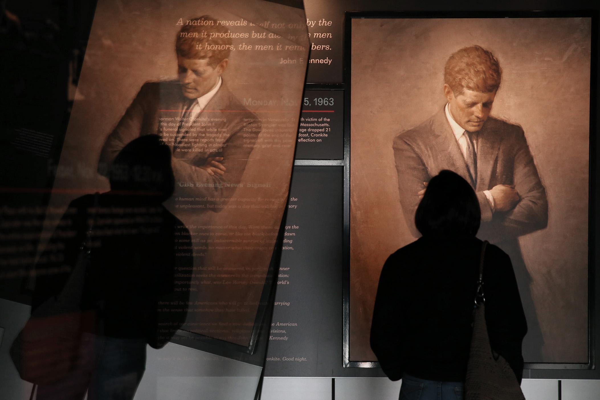 People tour an exhibit at the Newseum dedicated to John F. Kennedy on November 22, 2013, in Washington, D.C.