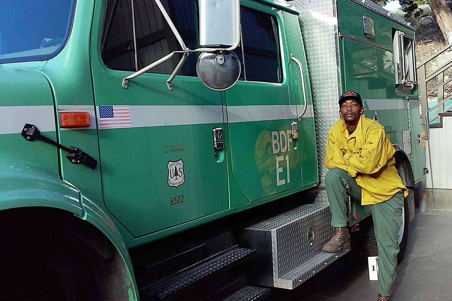 Brandon Smith standing next to a U.S. Forest Service truck.