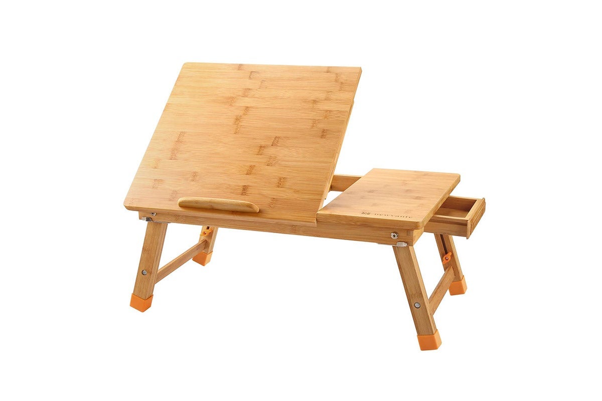 A wooden laptop desk where part of the surface lifts up.
