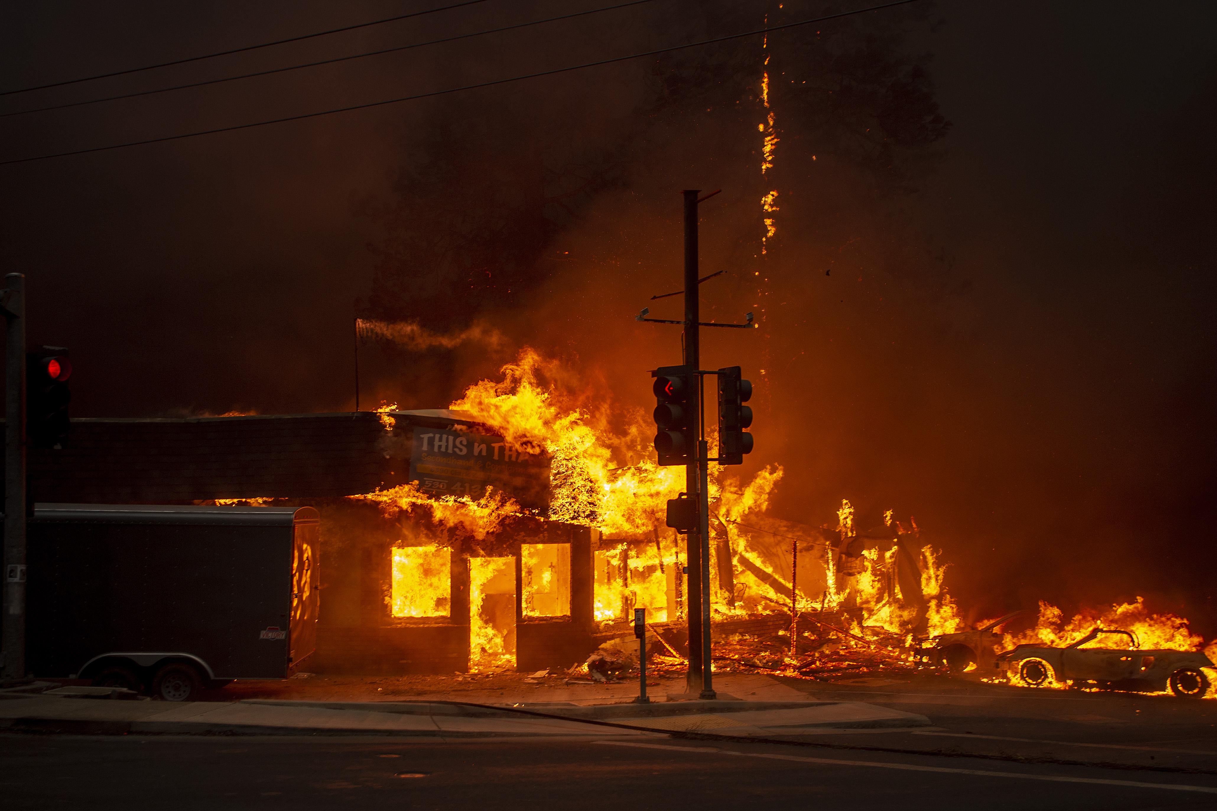 A store in flames at night