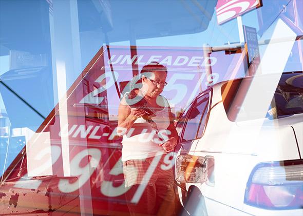 A customer puts gas into a vehicle at the U-gas station on December 8, 2014 in Miami, Florida.