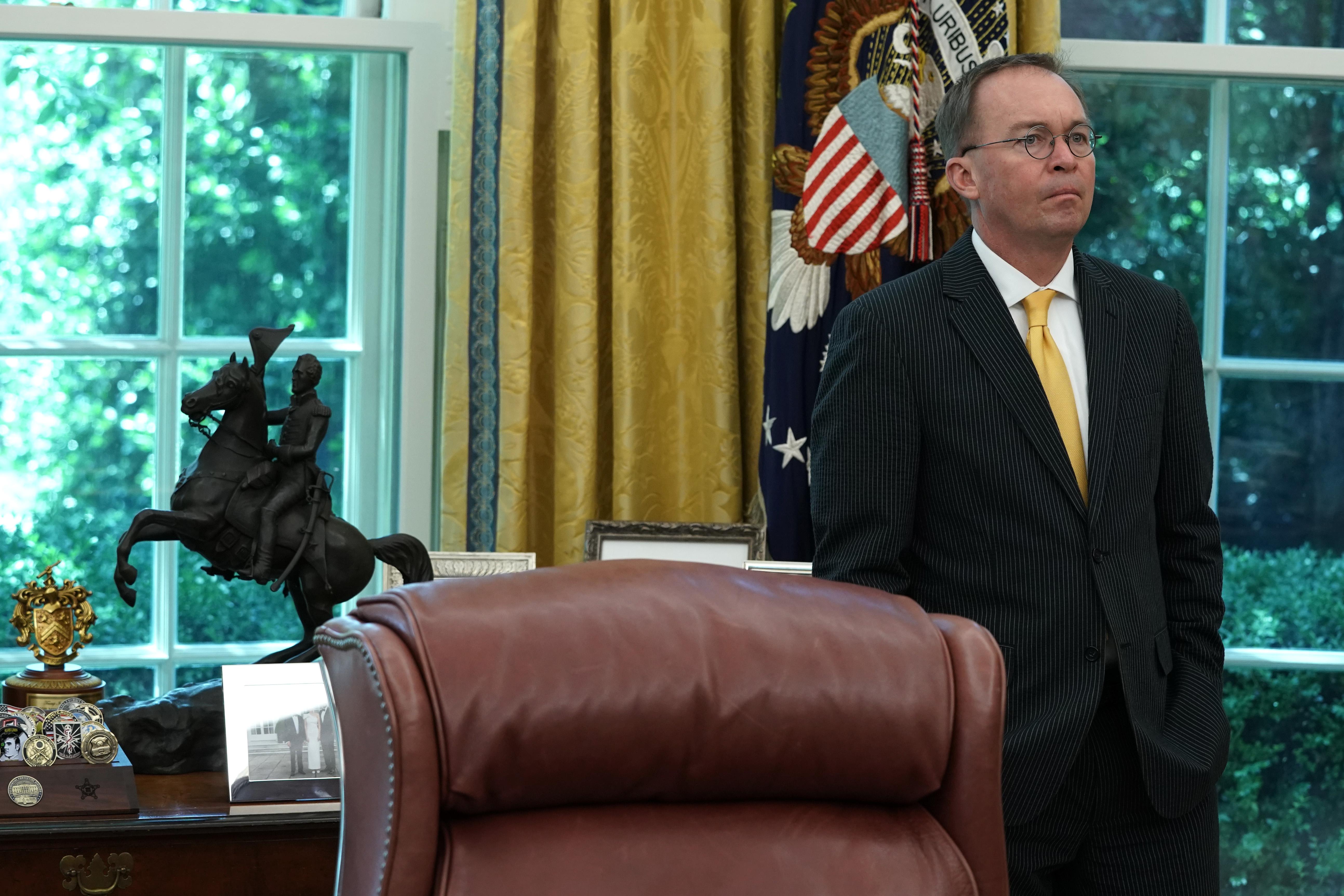 Acting White House Chief of Staff Mick Mulvaney listens during a meeting between President Donald Trump and Qatari Emir Sheikh Tamim bin Hamad Al Thani in the Oval Office at the White House July 9, 2019 in Washington, D.C.
