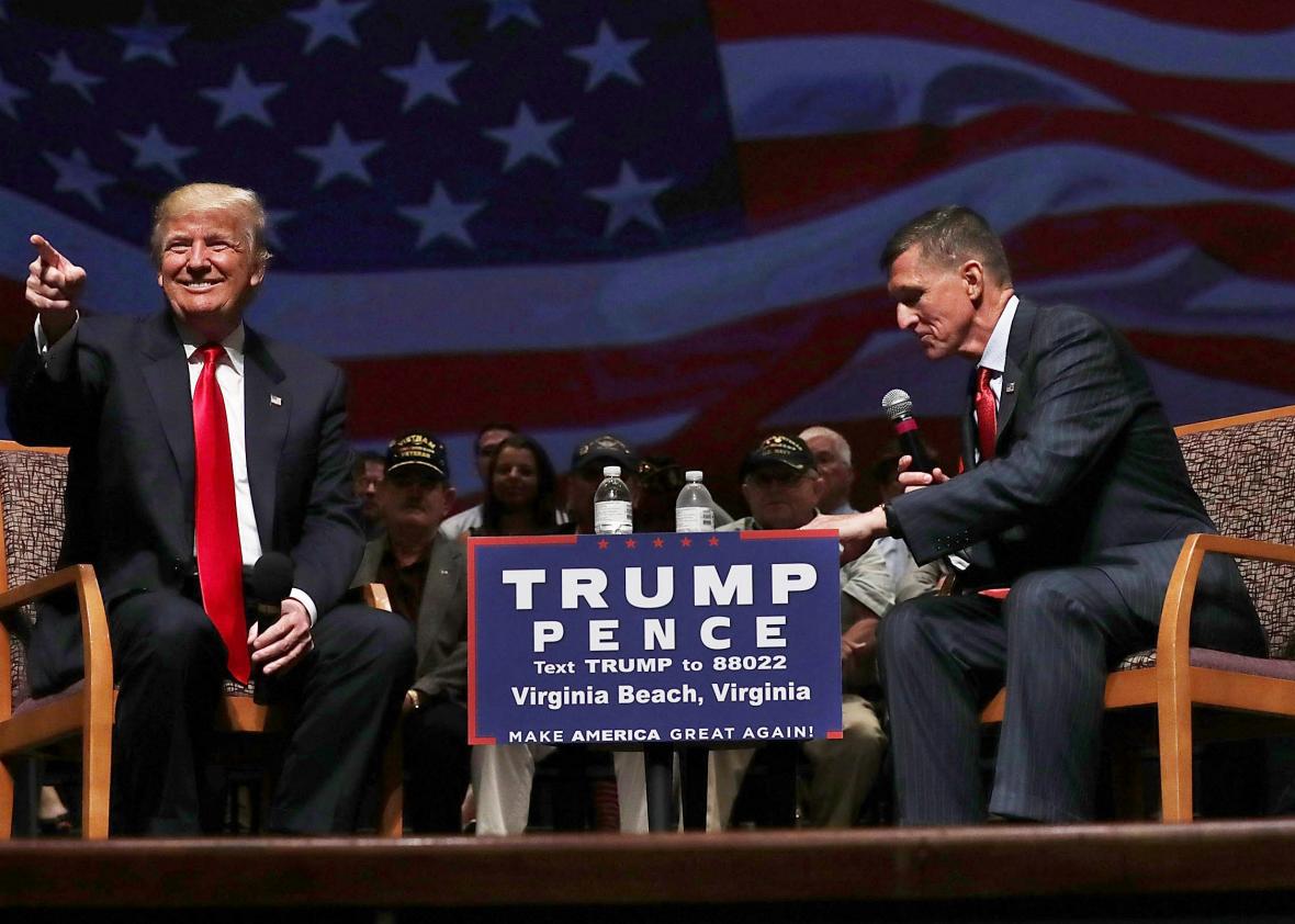 Republican presidential nominee Donald Trump acknowledges the crowd during a campaign event with Mike Flynn on  September 6, 2016 in Virginia Beach, Virginia. 