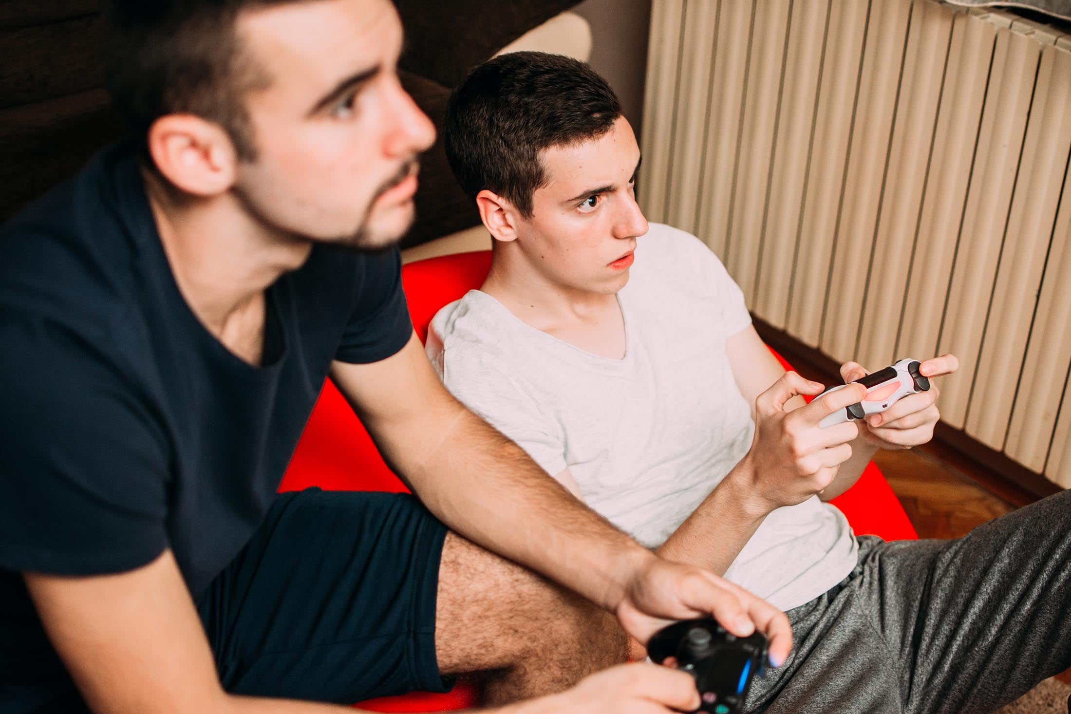 Two young men playing video games.