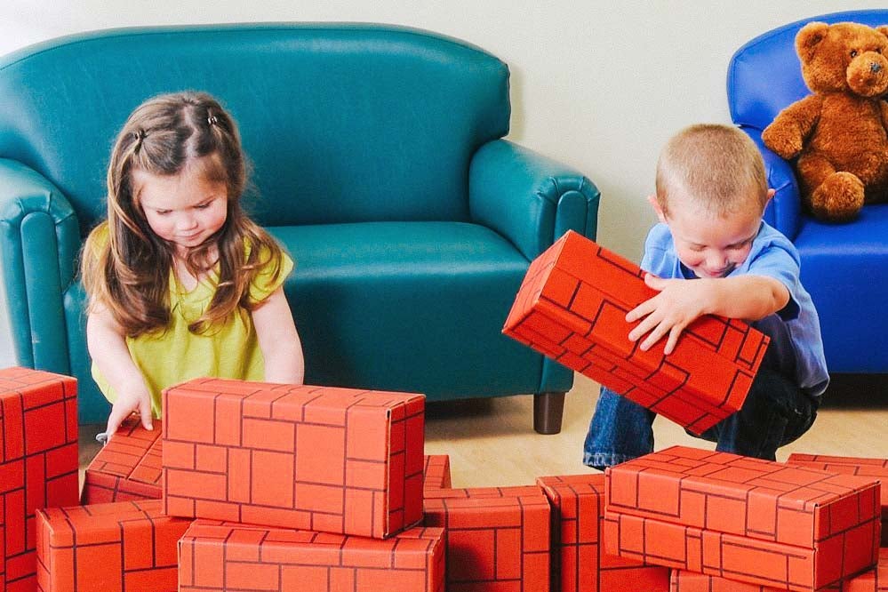 Constructive Playthings brick colored card board boxes.