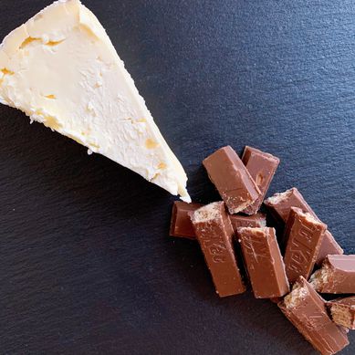 Wedge of triple-cream cheese with Kit Kat pieces