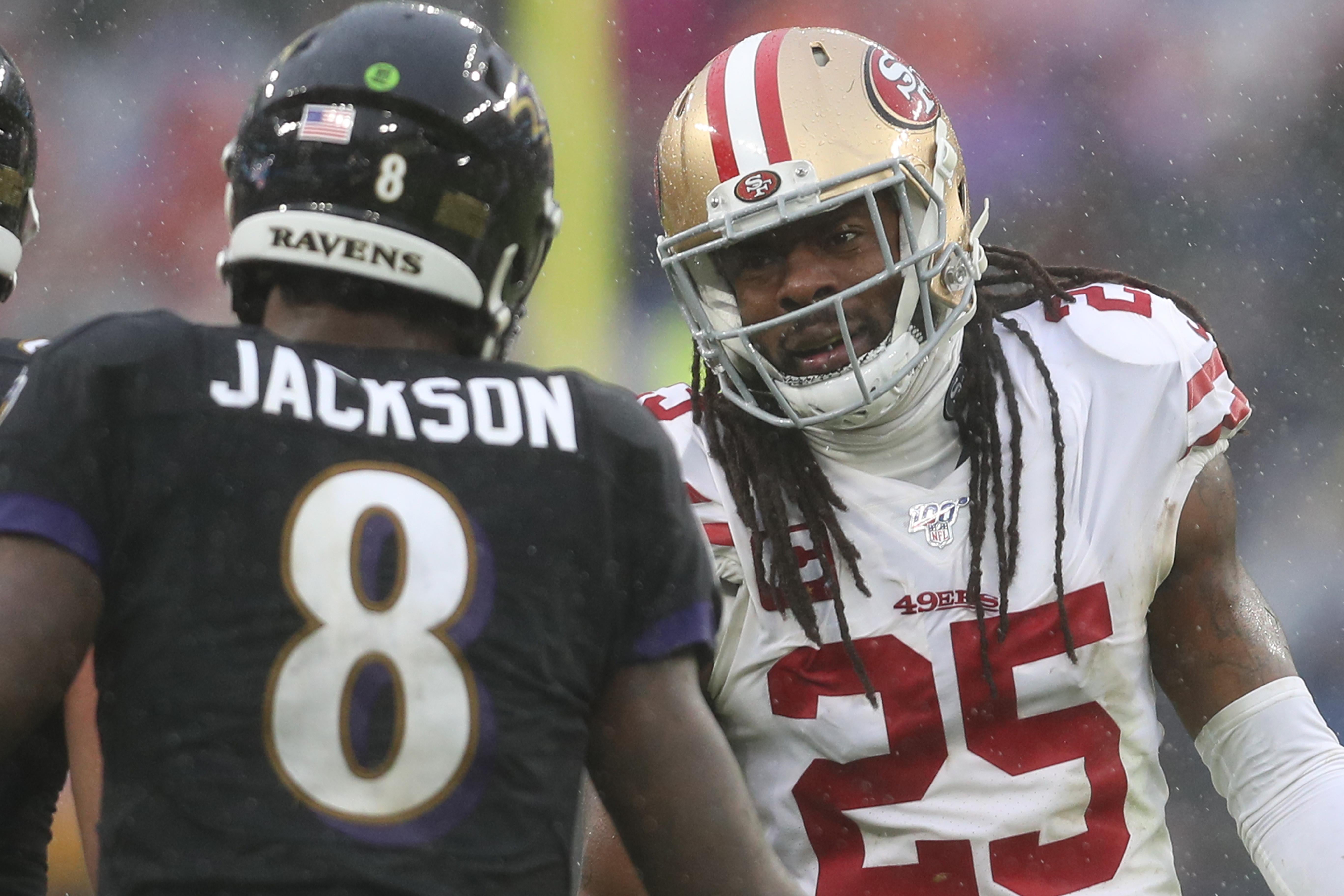 BALTIMORE, MARYLAND - DECEMBER 01: Quarterback Lamar Jackson #8 of the Baltimore Ravens and cornerback Richard Sherman #25 of the San Francisco 49ers talk during the second half at M&T Bank Stadium on December 01, 2019 in Baltimore, Maryland. (Photo by Patrick Smith/Getty Images)