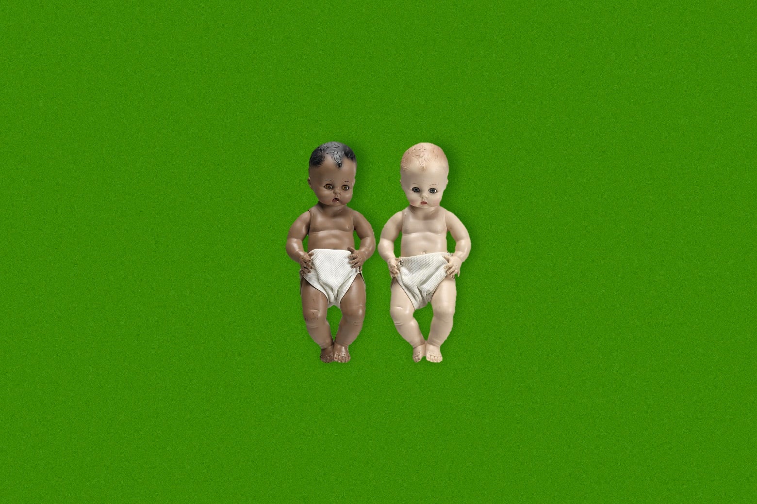 A Black baby doll and white baby doll