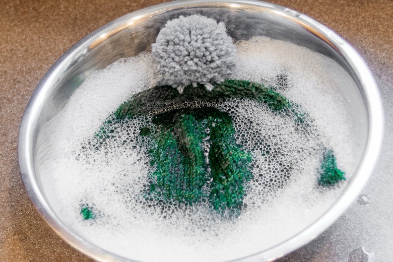 a hat in a soapy tub