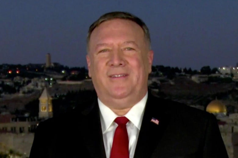 Pompeo speaking outside, with the Old City of Jerusalem behind him