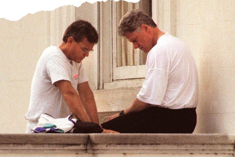 Bill Hybels and President Bill Clinton, heads bowed in pray.