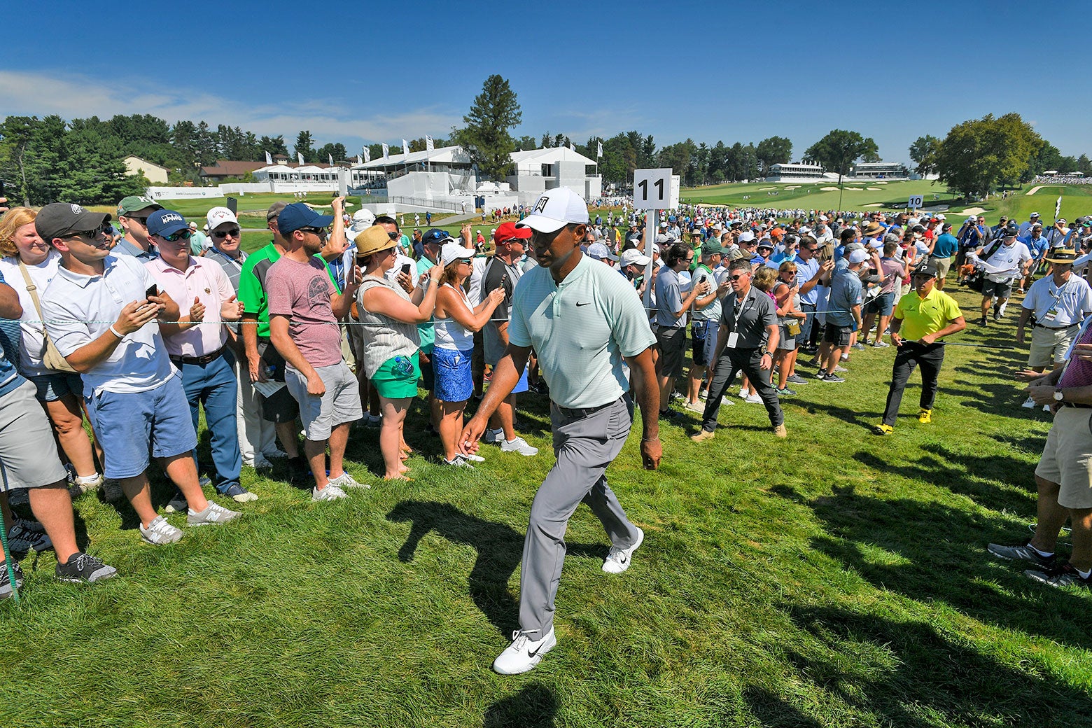 Tiger Woods walks along the 11th hole during the first round of the BMW Championship.