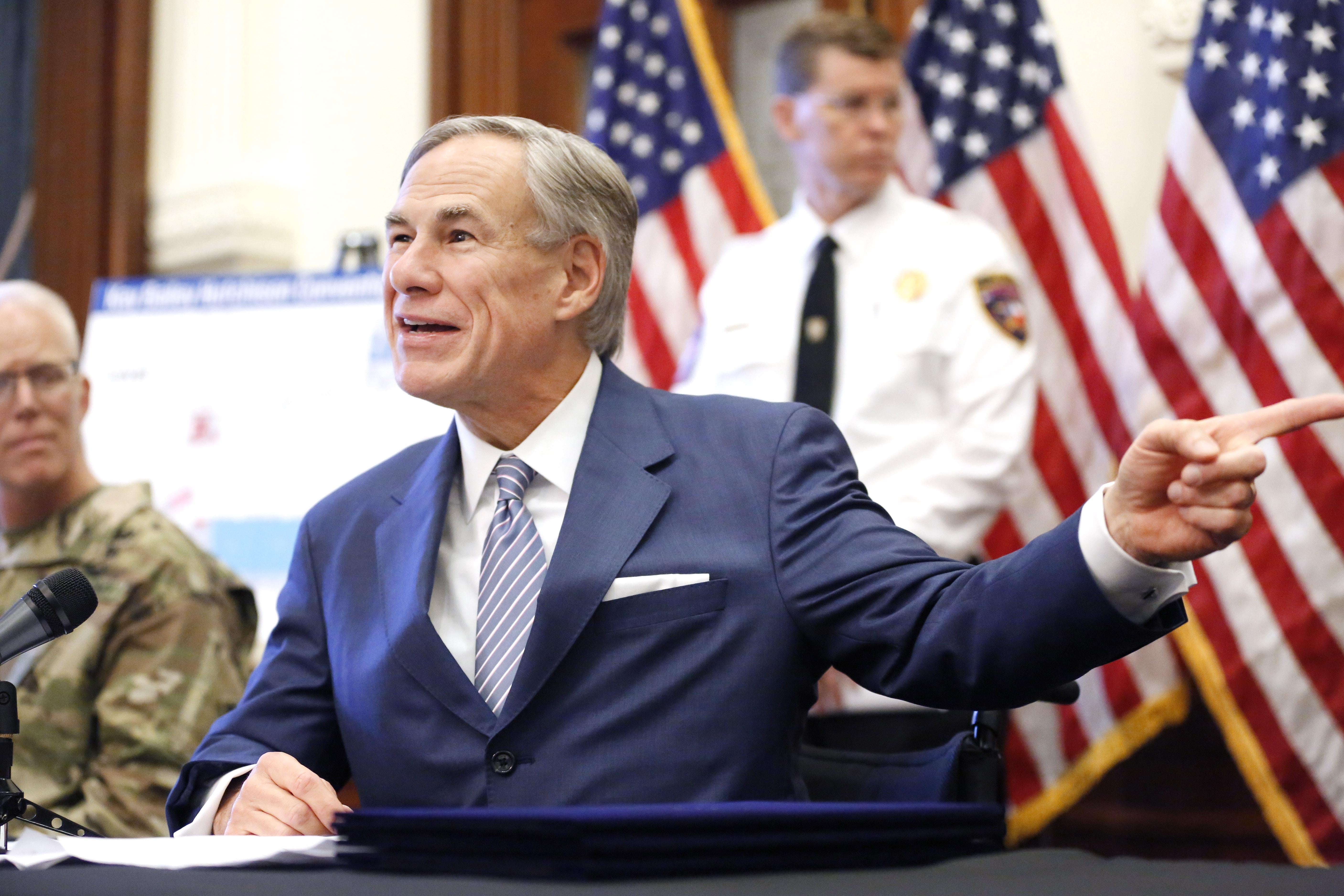 Abbott pointing and smiling.