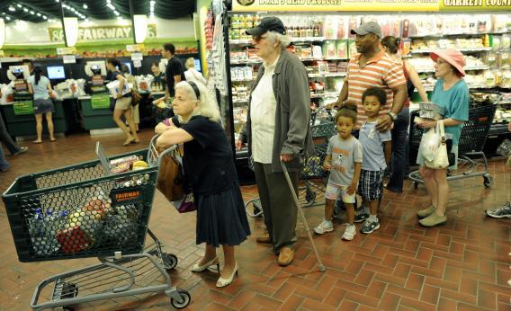 New Yorkers line up for the checkout line at the Fairway Supermarket on the Upper East Side of New York as Hurricane Irene continued toward the East Coast