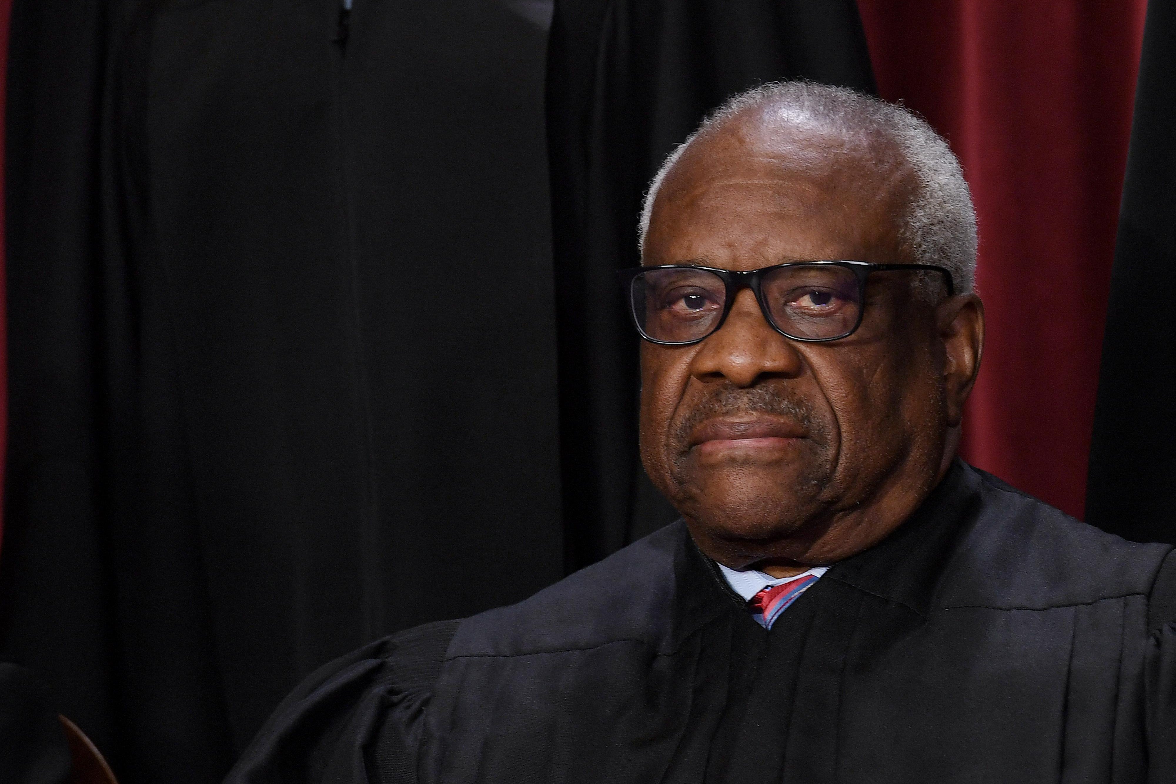Thomas, at the Supreme Court, looks sternly ahead.