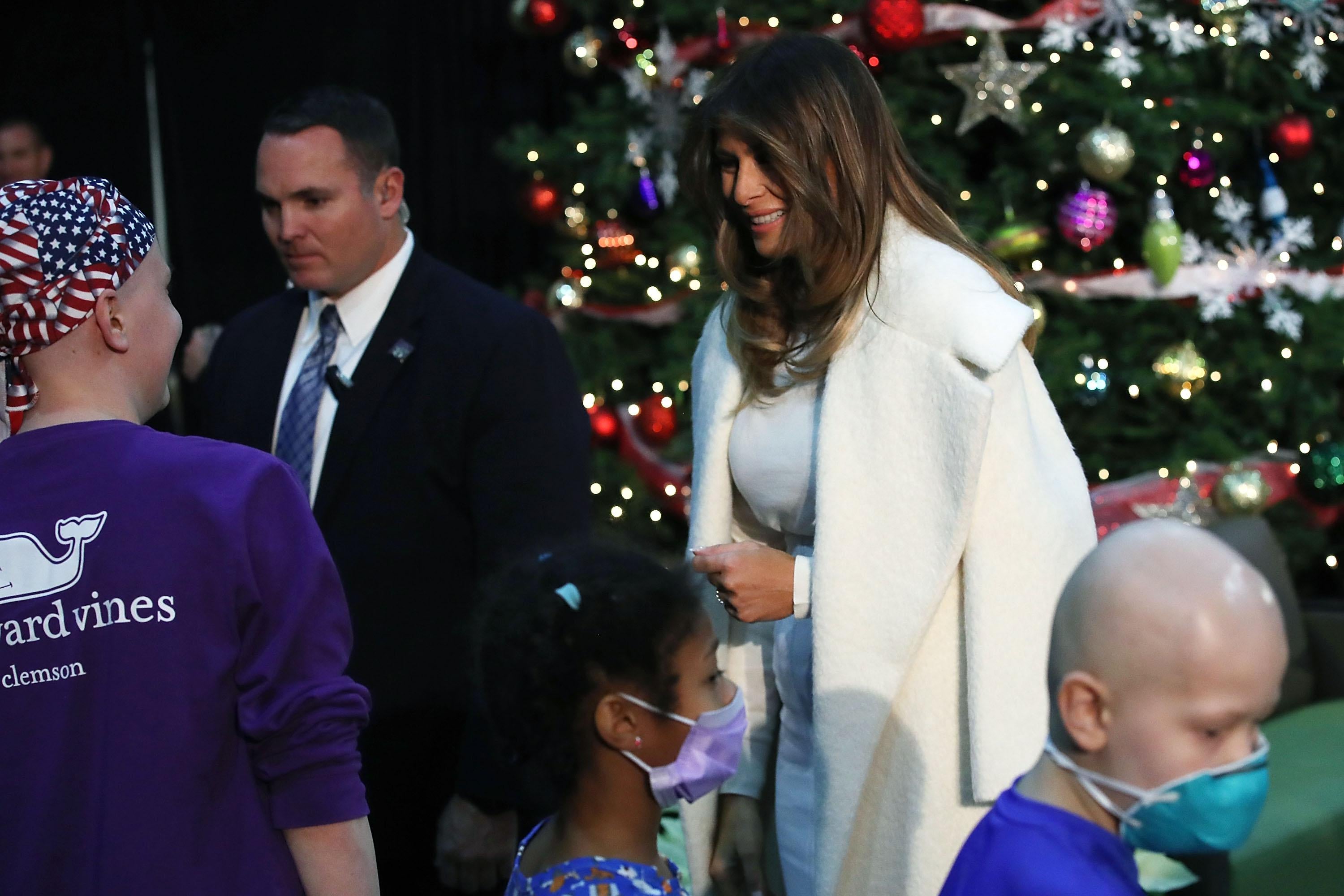 WASHINGTON, DC - DECEMBER 07: First lady Melania Trump greets children after reading the Christmas book, The Polar Express at Children's National Medical Center, on December 7, 2017 in Washington, DC. First ladies dating back to Jacqueline Kennedy have made the annual visit to the Washington area hospital during the holiday season. (Photo by Mark Wilson/Getty Images)