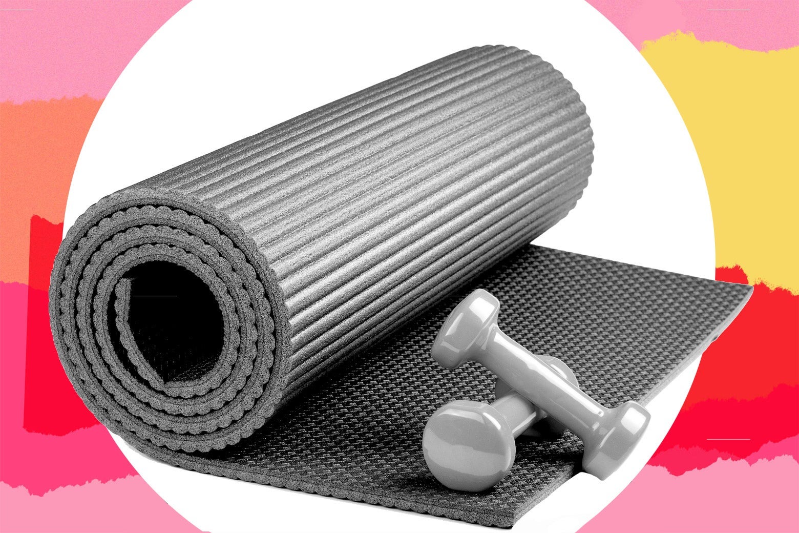 A rolled-up yoga mat and two weights.