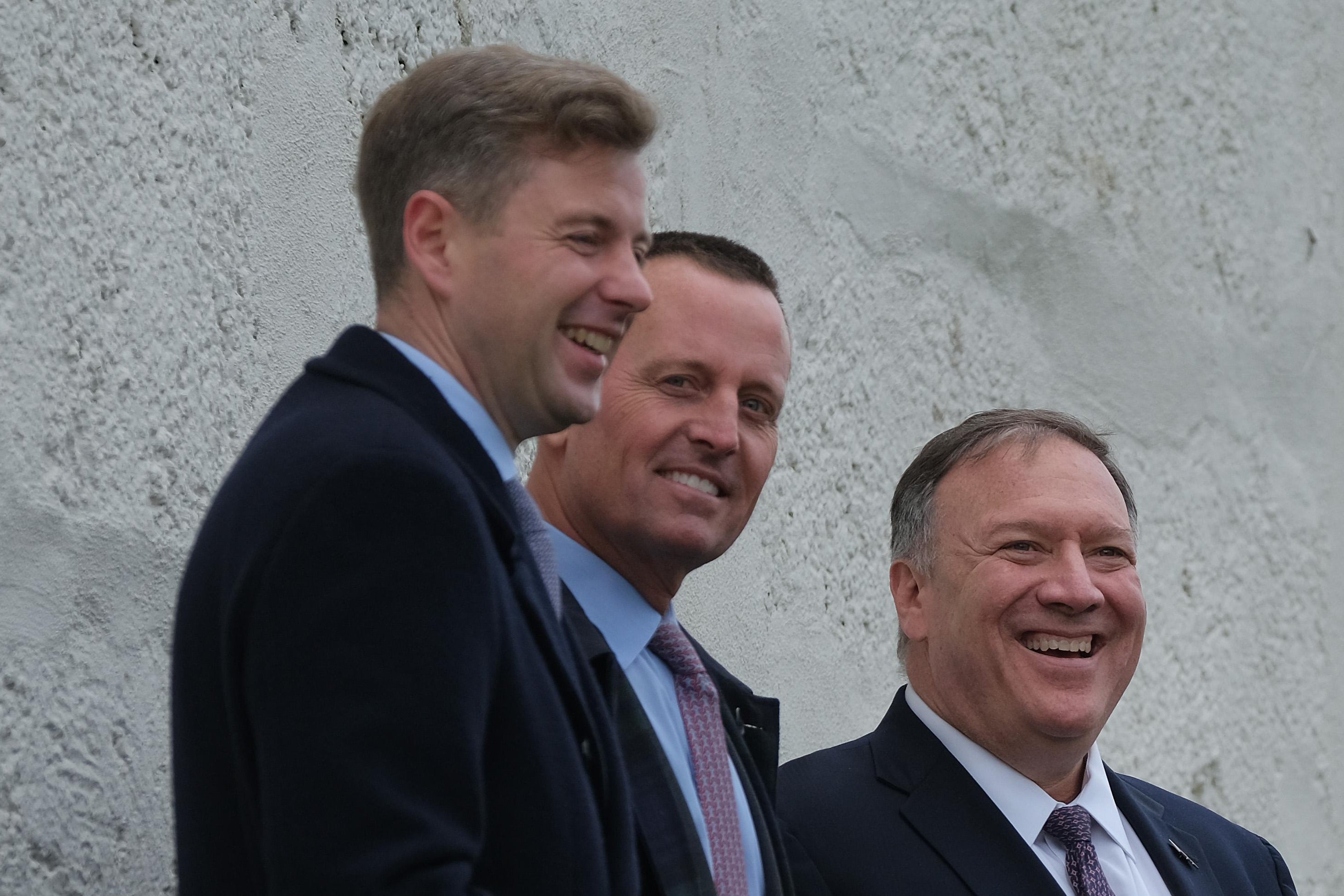 Grenell and Pompeo at a still-standing portion of the East Germany–West Germany border