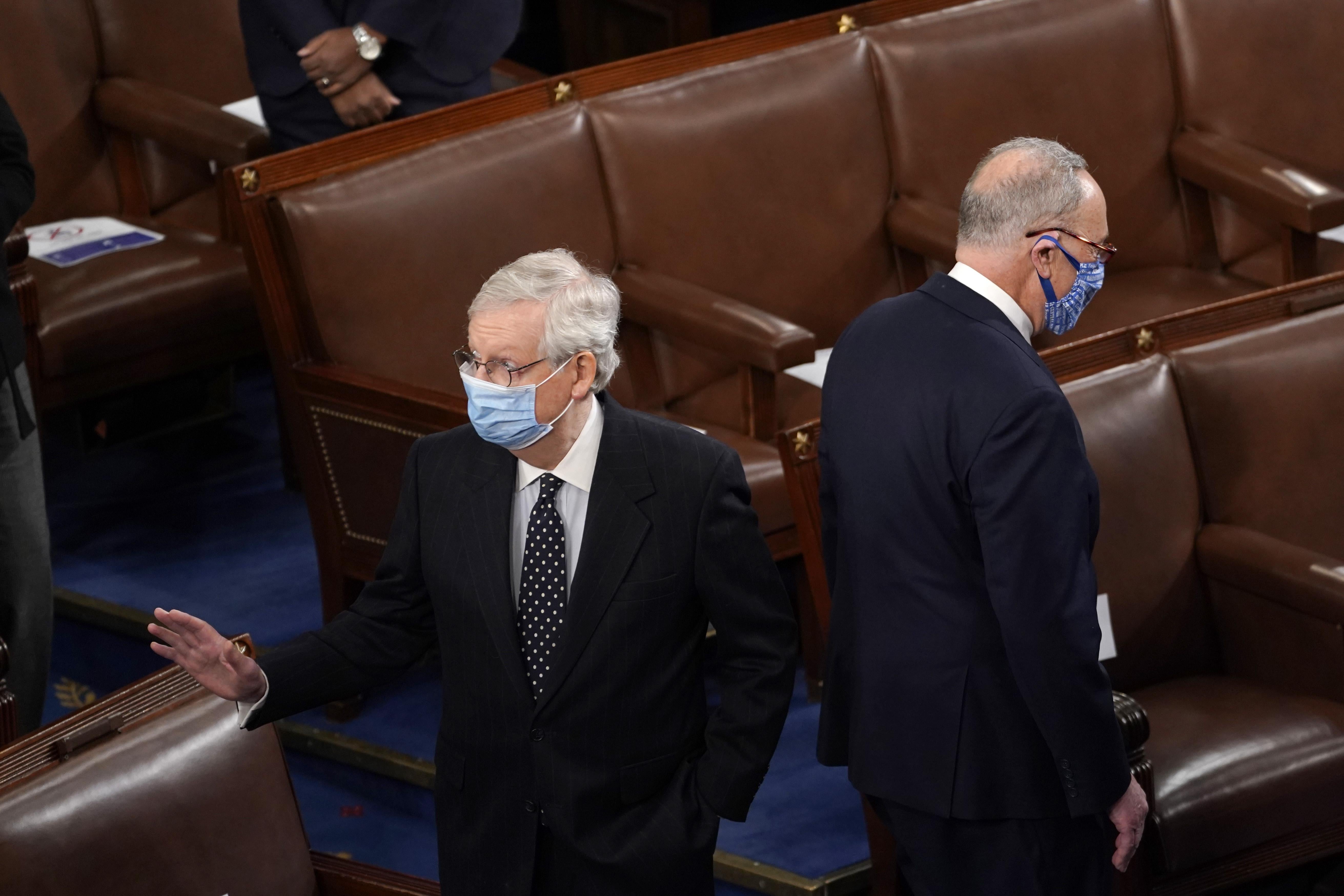 McConnell and Schumer stand back to back in the House chamber