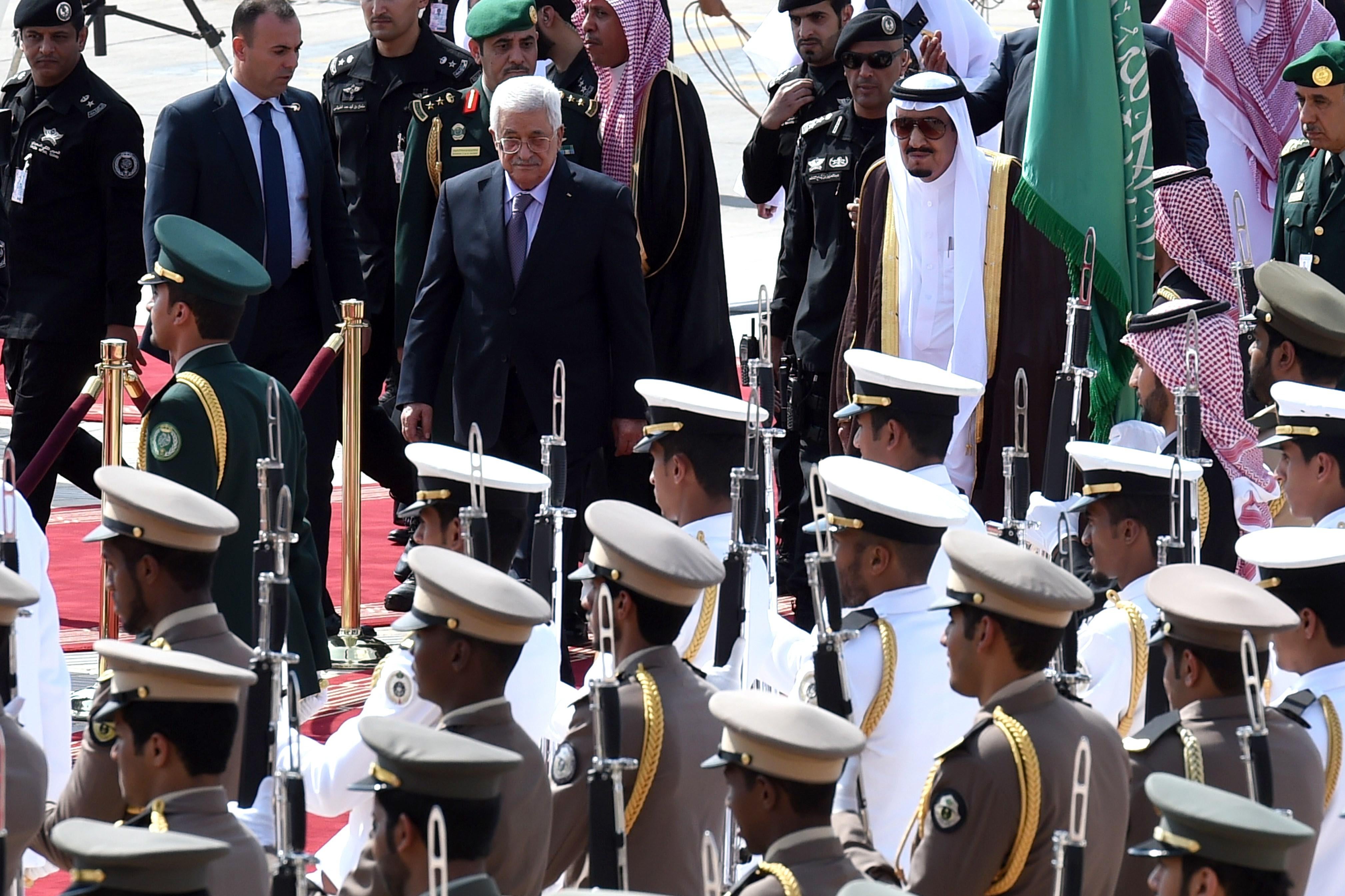 Saudi King Salman bin Abdulaziz (R) reviews the honour guard with Palestinian President Mahmoud Abbas during a welcoming ceremony for the latter held at King Khalid International Airport in Riyadh, on Nov. 10, 2015. Arab leaders and top officials from South America are converging on Saudi Arabia for a summit aiming to strengthen ties between the geographically distant but economically powerful regions. AFP PHOTO / FAYEZ NURELDINE        (Photo credit should read FAYEZ NURELDINE/AFP/Getty Images)