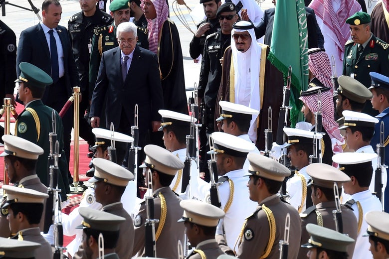 Saudi King Salman bin Abdulaziz (R) reviews the honour guard with Palestinian President Mahmoud Abbas during a welcoming ceremony for the latter held at King Khalid International Airport in Riyadh, on Nov. 10, 2015. Arab leaders and top officials from South America are converging on Saudi Arabia for a summit aiming to strengthen ties between the geographically distant but economically powerful regions. AFP PHOTO / FAYEZ NURELDINE (Photo credit should read FAYEZ NURELDINE/AFP/Getty Images)