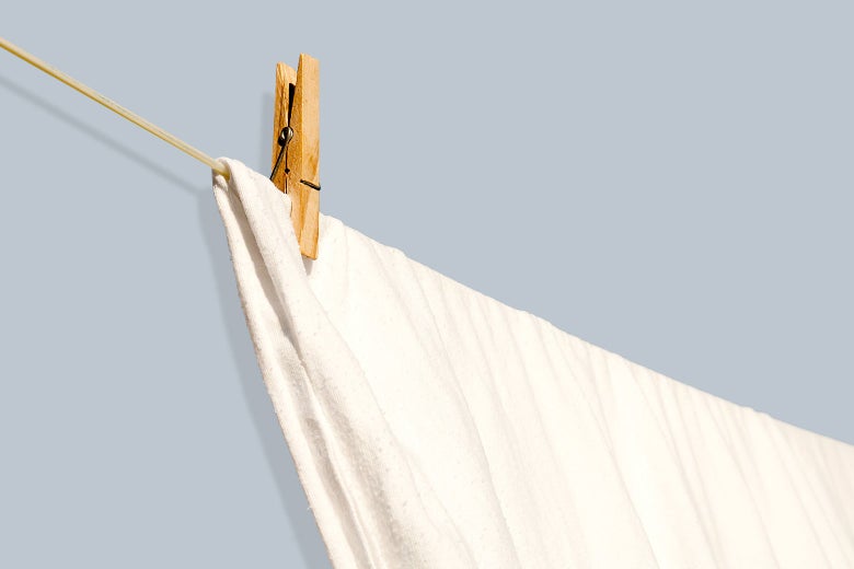 A single sheet hanging on a clothesline.