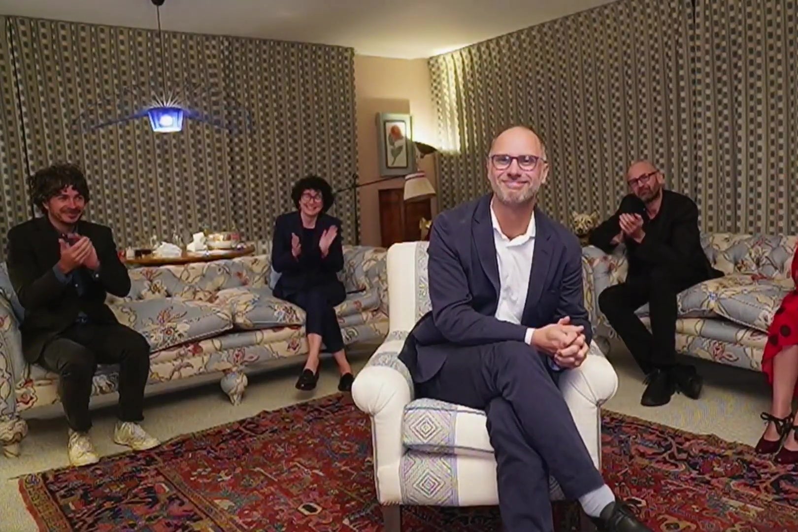 Jesse Armstrong winning an Emmy, surrounded by friends and family.