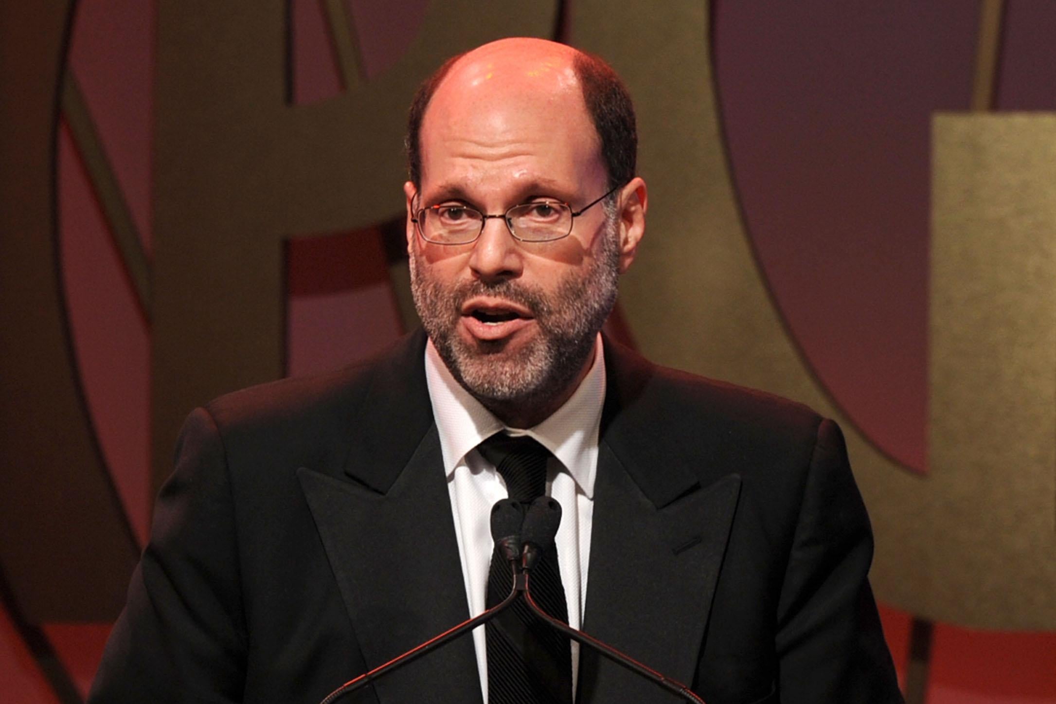 Scott Rudin in a black suit and tie.