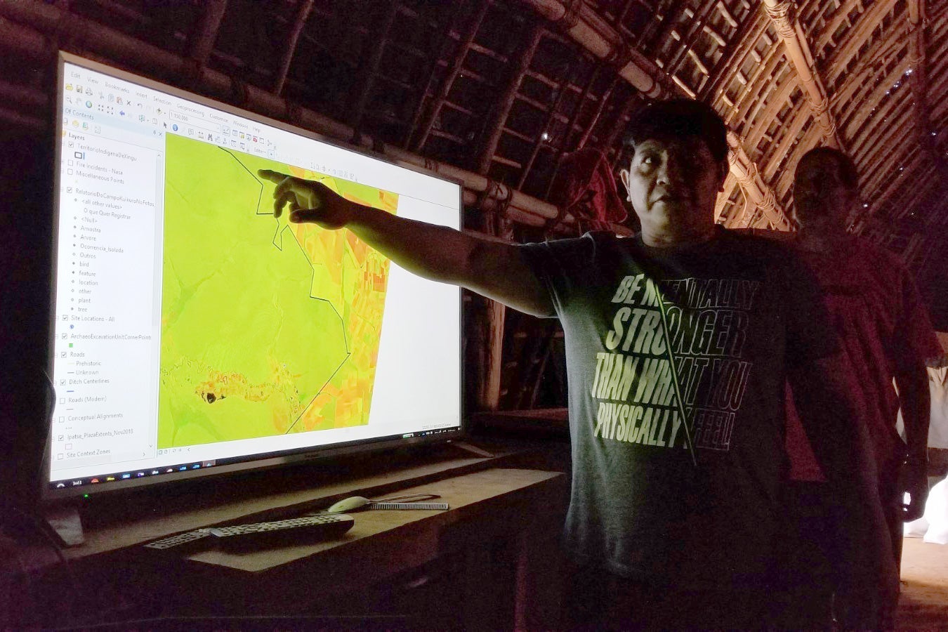 Yanamá Kuikuro, president of the Kuikuro Indigenous Association of Upper Xingu, points to a satellite image of the Kuikuro territory.