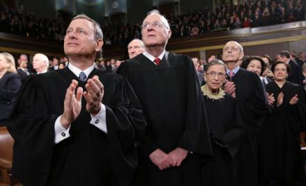 Supreme Court Justices Chief Justice John Roberts, Anthony Kennedy, Ruth Bader Ginsburg, Stephen Breyer, Sonia Sotomayor and Elena Kagan (L-R) applaud prior to President Obama's State of the Union speech on Capitol Hill in Washington.