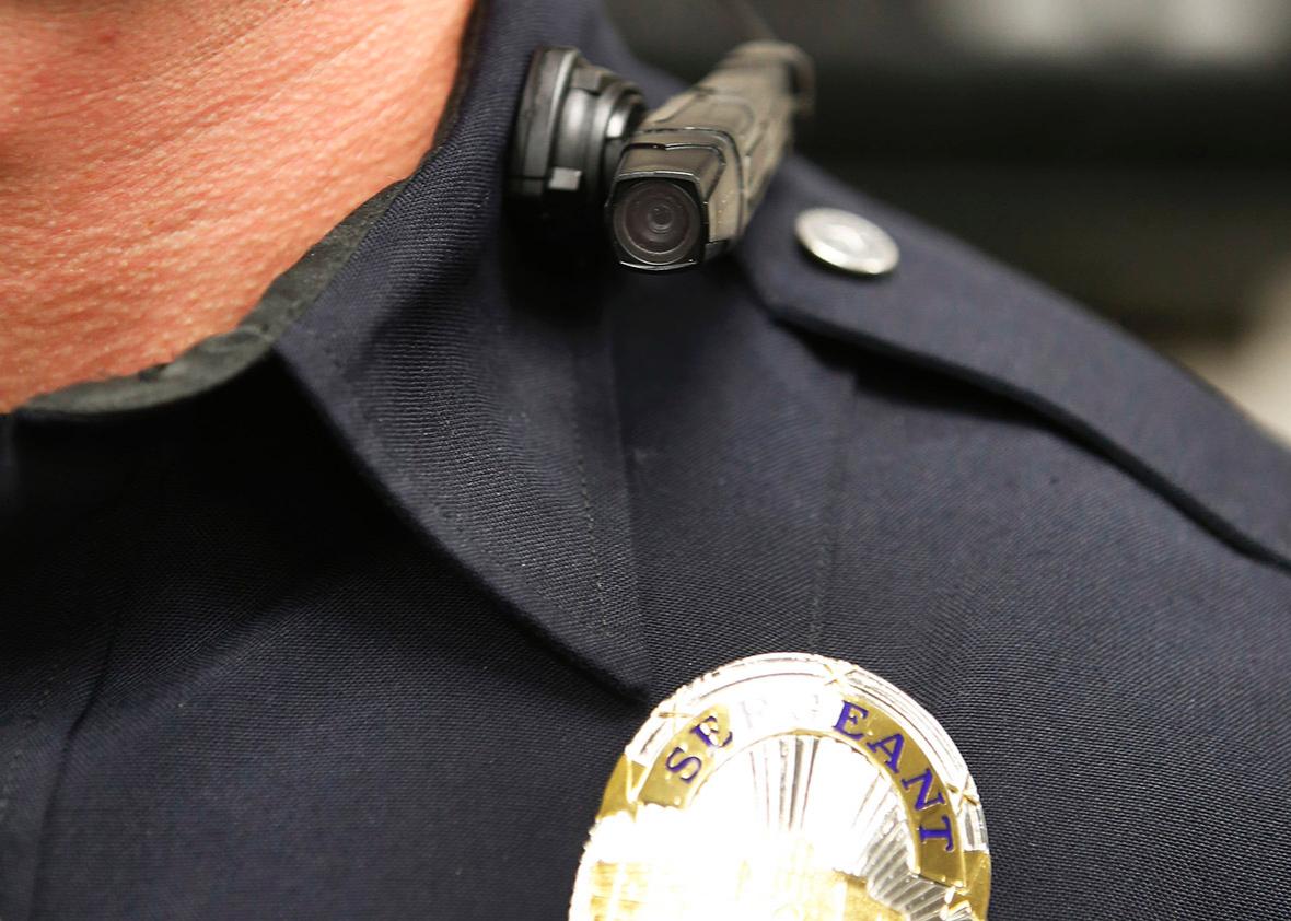 A West Valley City police officer shows off a newly-deployed body camera attached to his shirt collar on March 2, 2015 in West Valley City, Utah. 