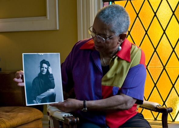 Jae Whitaker with portrait of Janis Joplin.