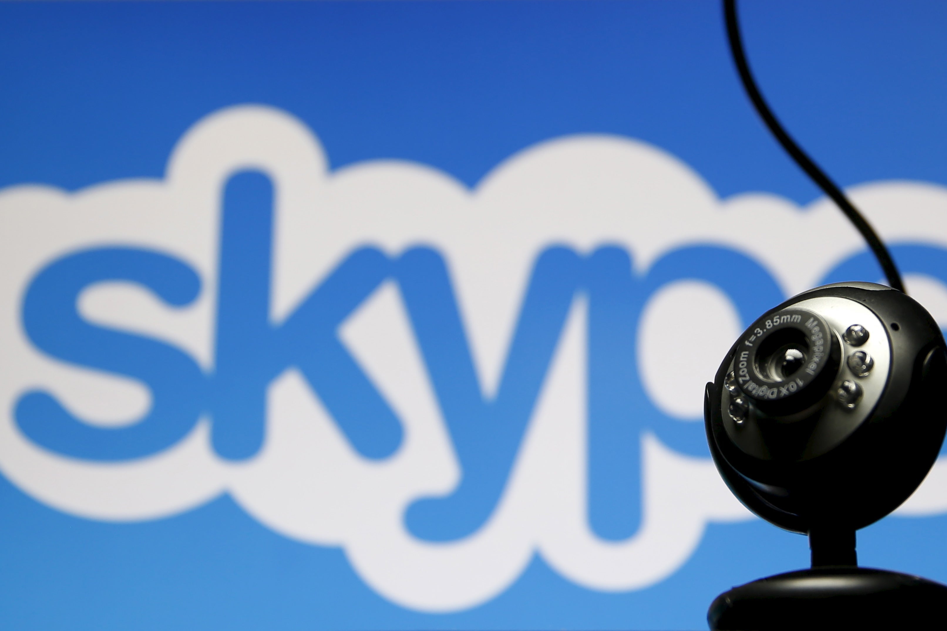 A webcam in front of the Skype logo