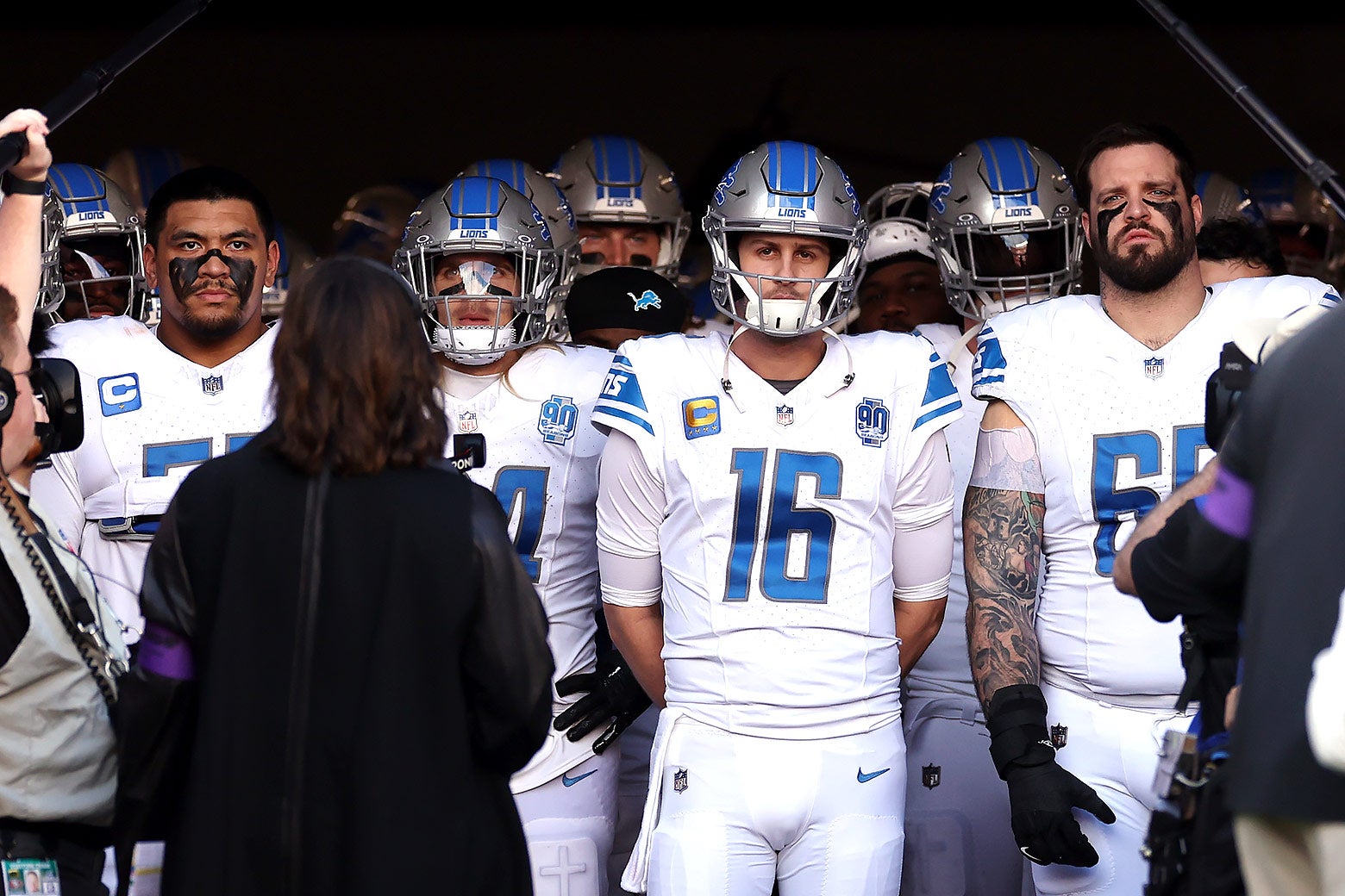 The Lions, with QB Jared Goff centered, stand grim-faced together in the tunnel at the SF stadium on Sunday.