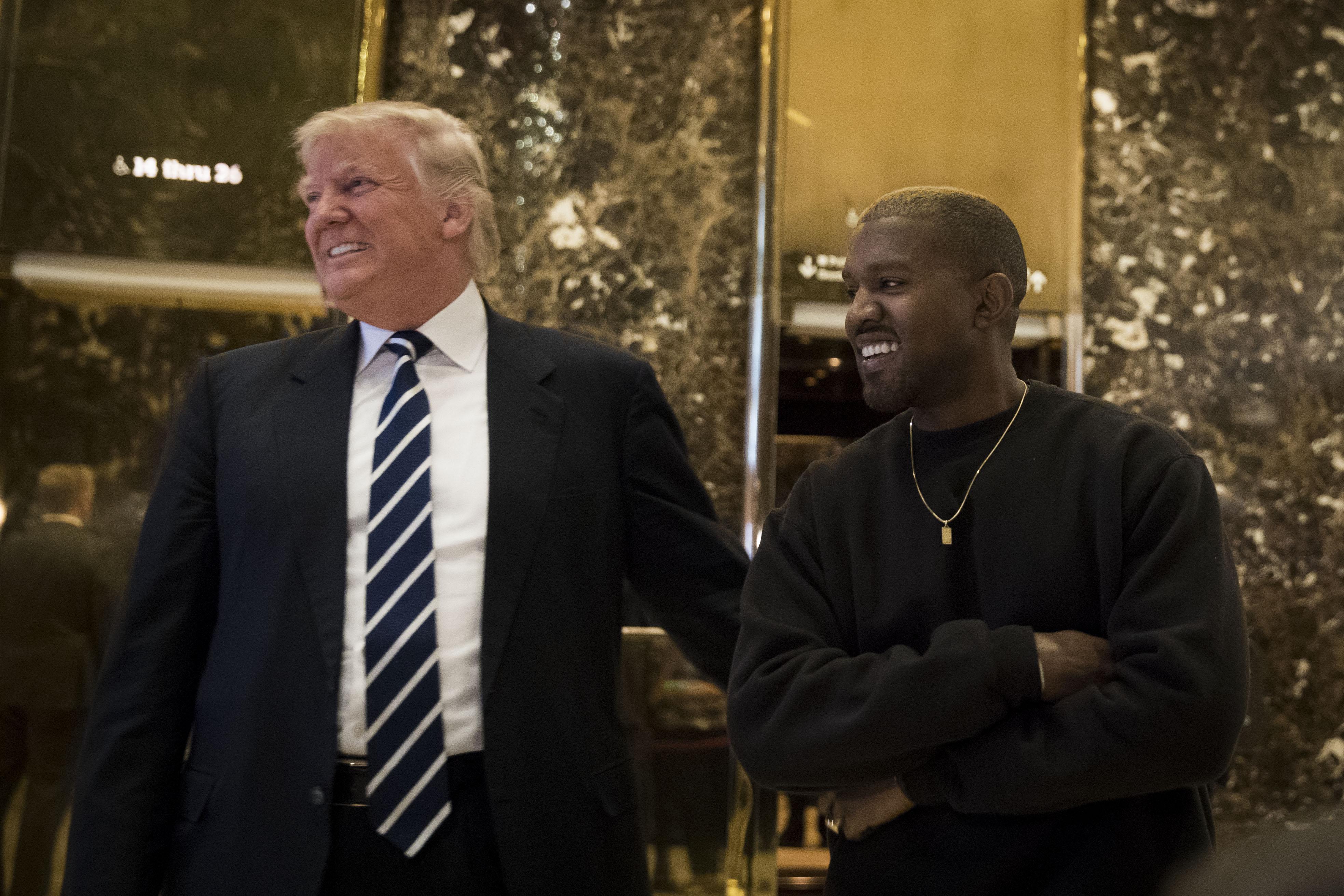 President-elect Donald Trump and Kanye West stand together in the lobby at Trump Tower, December 13, 2016 in New York City. President-elect Donald Trump and his transition team are in the process of filling cabinet and other high level positions for the new administration.