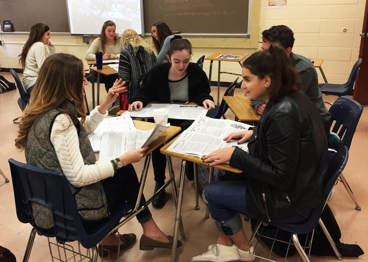 Northport, N.Y., High School seniors look for examples of direct evidence and verified information in news stories. 