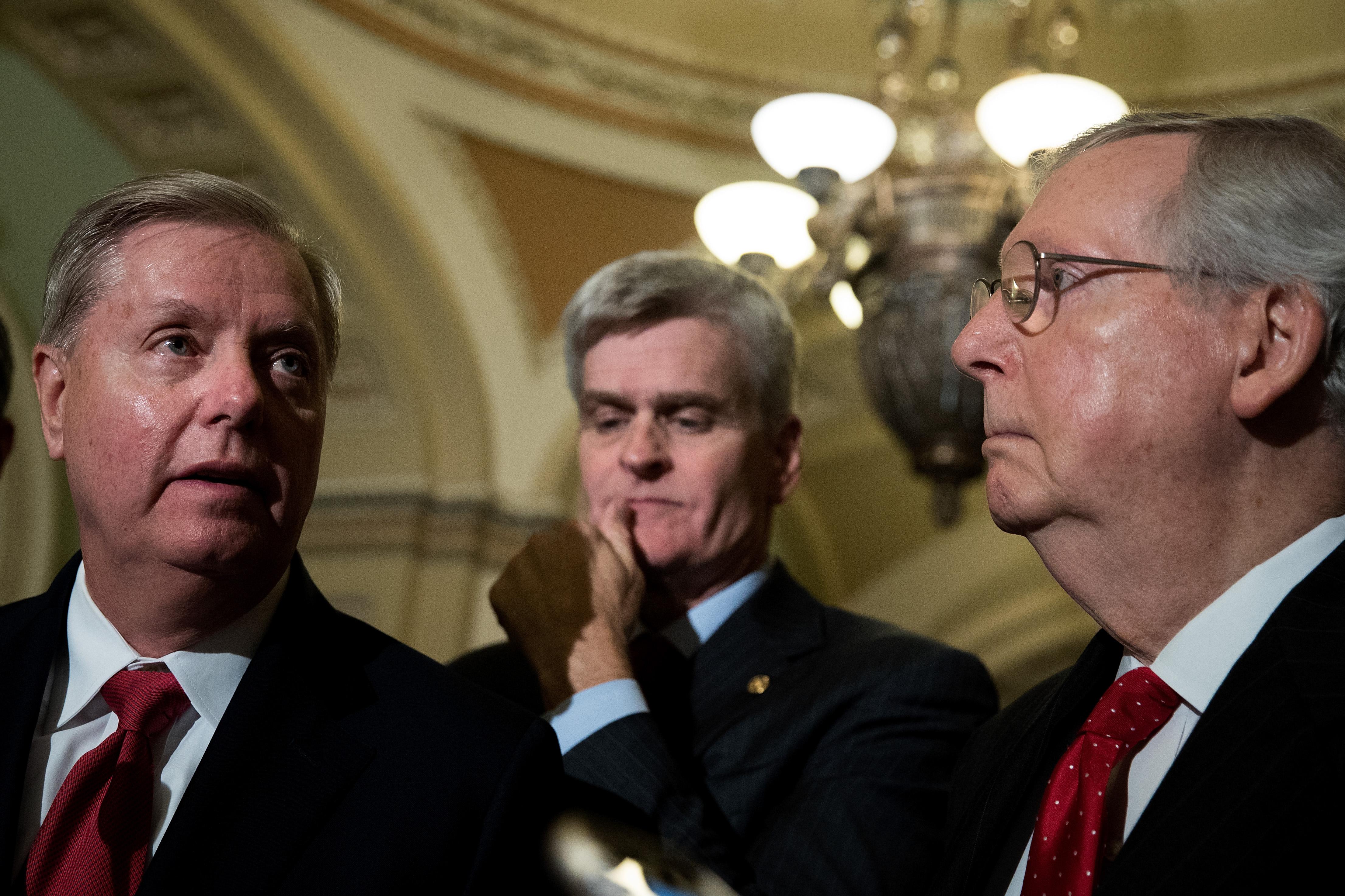 Lindsey Graham (R-SC), Bill Cassidy (R-LA) and Majority Leader Mitch McConnell (R-KY) take questions from reporters during a news conference following their weekly policy luncheon, September 26, 2017 in Washington, D.C. 