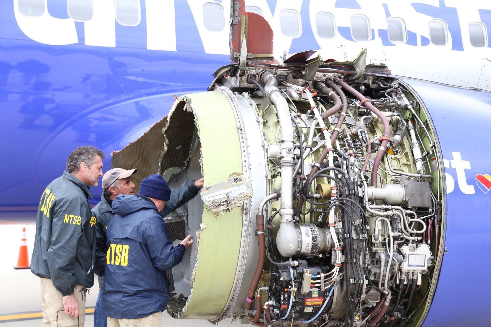 The plane's damaged and exposed left engine.