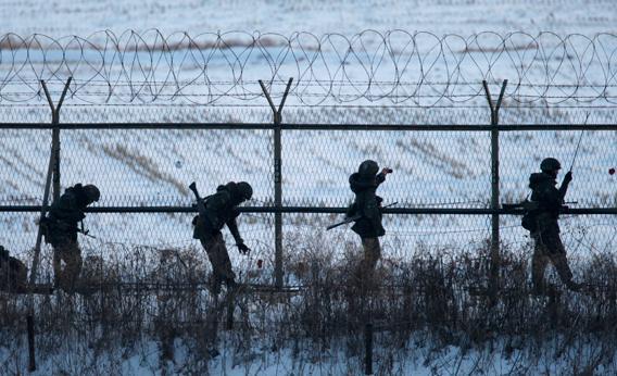 South Korean soldiers check military fences as they patrol near the demilitarized zone separating North Korea from South Korea, in Paju, north of Seoul February 12, 2013.