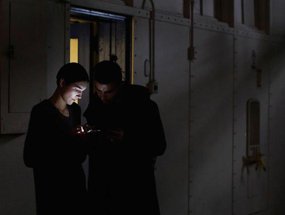 A man and woman looking at a mobile phone in New York, February 11, 2013.