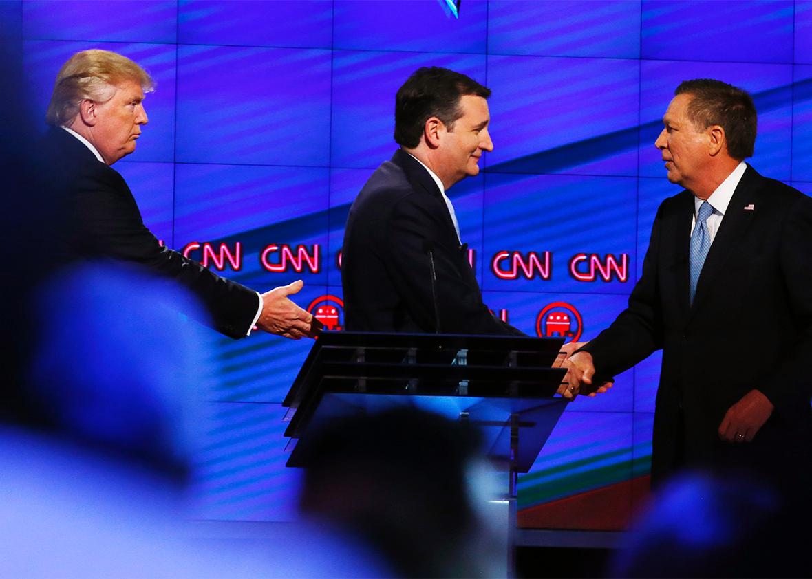 Donald Trump, Texas Senator Ted Cruz and Ohio Governor John Kasich shake hands following the CNN Republican Presidential Debate March 10, 2016 in Miami, Florida.